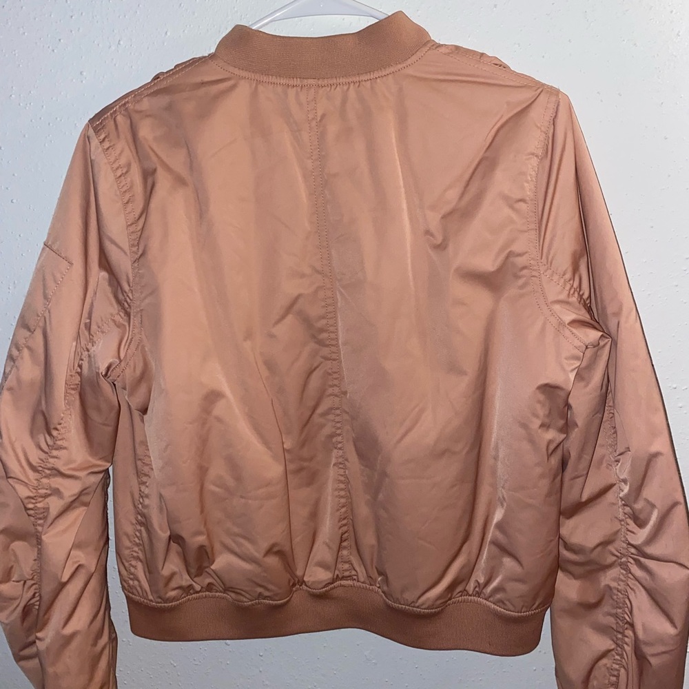 Cute pink jacket to compliment a fall/winter fit. Fairly used.